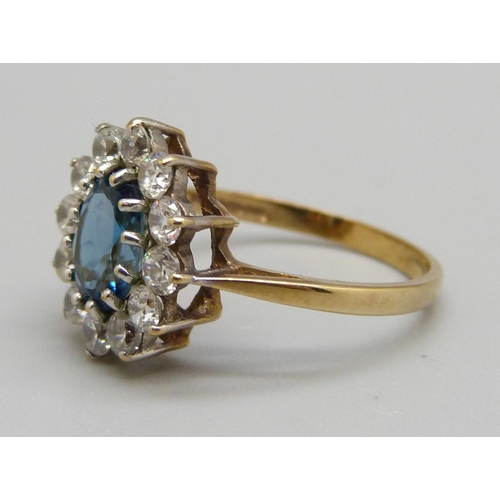 942 - A 9ct gold, topaz and white stone cluster ring, 2.8g, O