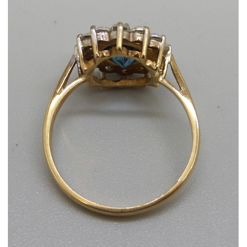 942 - A 9ct gold, topaz and white stone cluster ring, 2.8g, O