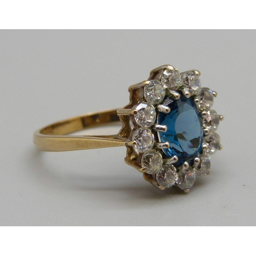 942 - A 9ct gold, topaz and white stone cluster ring, 2.8g, O