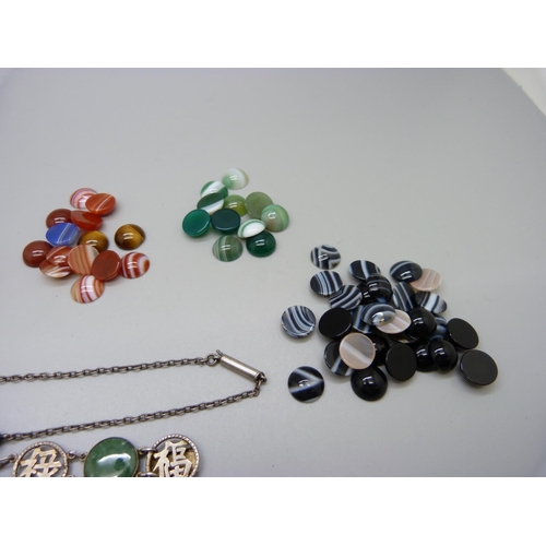 948 - A collection of unmounted agate stones, a jadeite bracelet and a turquoise necklace