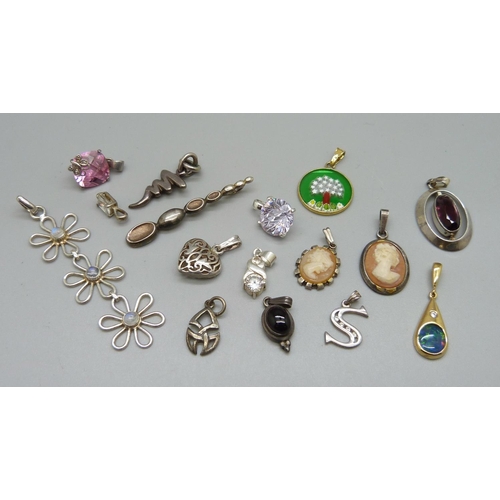 958 - A collection of silver pendants including opal, moonstone, etc.