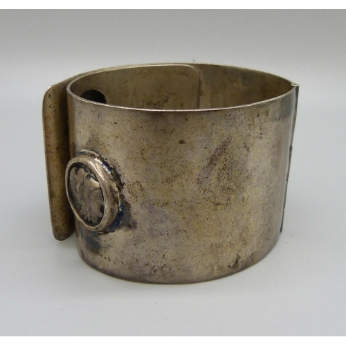 963 - A large hinged bangle, marked 900, 114g