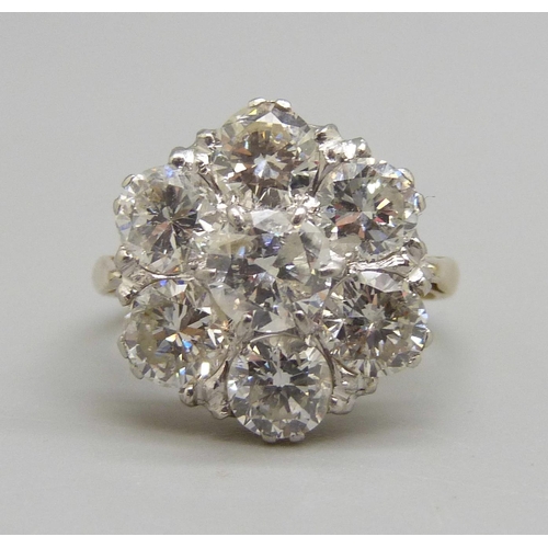 964 - An 18ct gold and platinum diamond cluster ring, 3.8 carat diamond weight, 5.3g, N