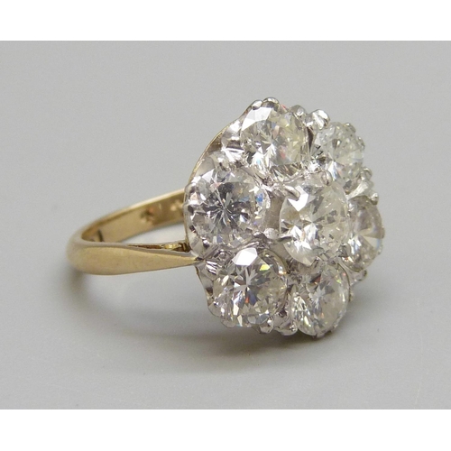 964 - An 18ct gold and platinum diamond cluster ring, 3.8 carat diamond weight, 5.3g, N