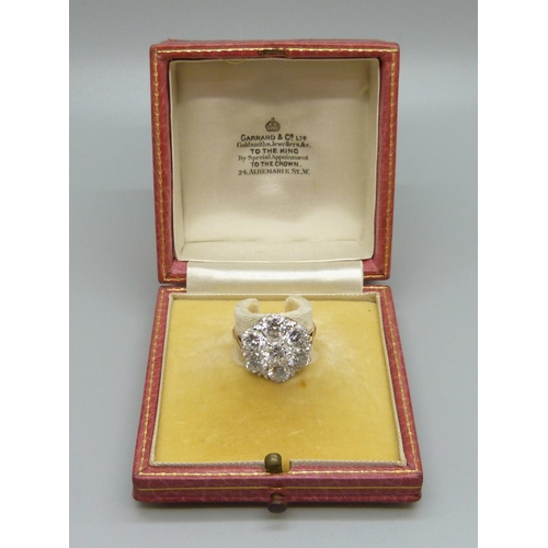 964 - An 18ct gold and platinum diamond cluster ring, 3.8 carat diamond weight, 5.3g, N