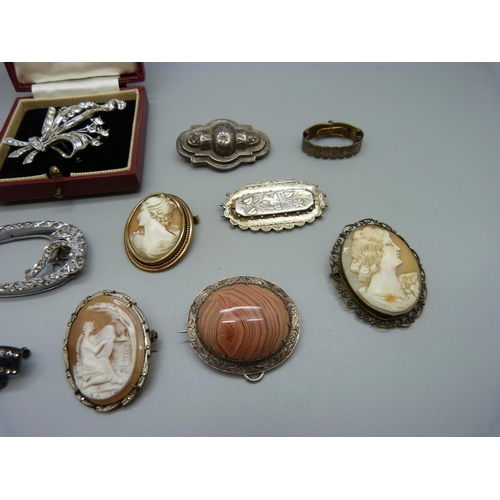 972 - Four Victorian brooches, one hallmarked silver, Birmingham 1889, a silver and paste set brooch with ... 