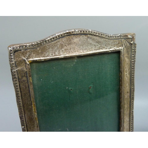 995 - Two silver photograph frames, oval fram 114mm x 138mm, one a/f