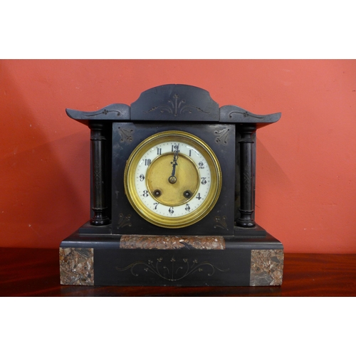 375 - A 19th Century French Belge noir mantle clock