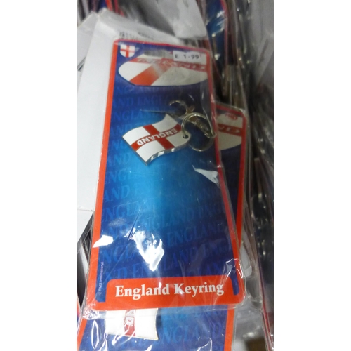 2104 - 2 Boxes of England football items - keyrings, inflatable hands etc.