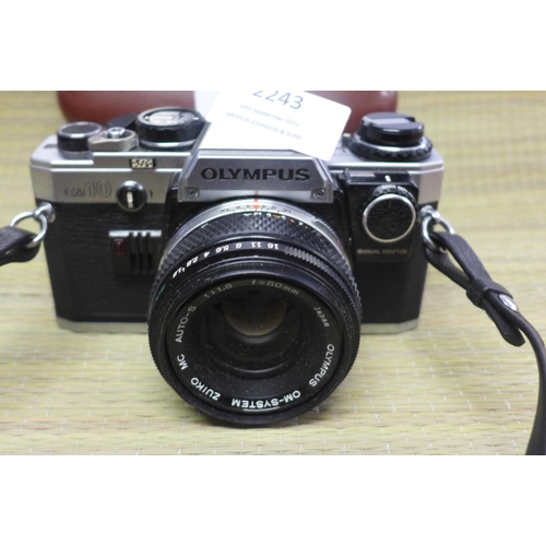 2243 - Olympus OM10 35mm SLR camera with 50mm f1.8 Zuiko standard lens and strap plus Werk King Regula 35mm... 