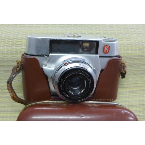 2243 - Olympus OM10 35mm SLR camera with 50mm f1.8 Zuiko standard lens and strap plus Werk King Regula 35mm... 