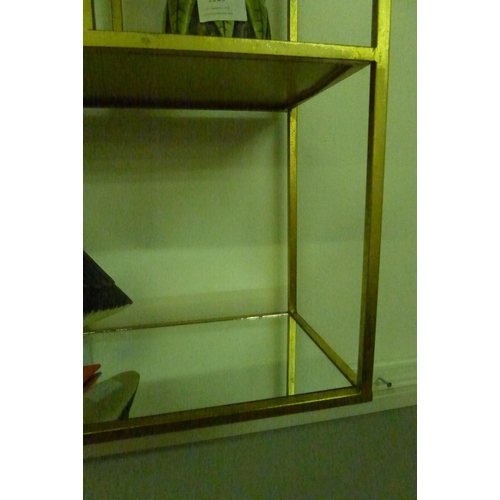 1331 - A gold mirrored wall shelf unit