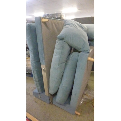 1486 - A sky blue velvet large L shaped sofa - damaged leg