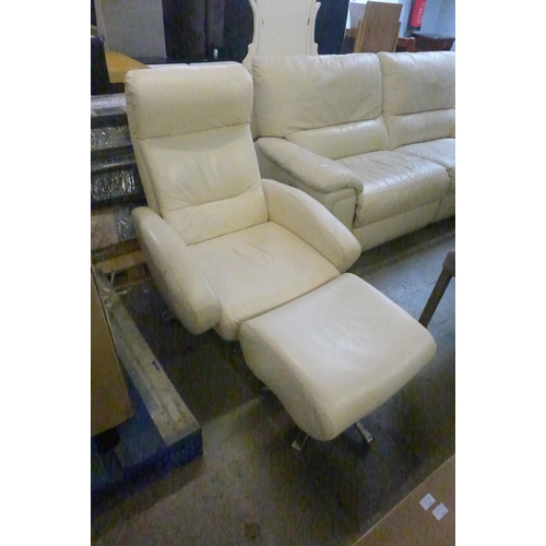 1516 - A cream leather and chrome armchair and footrest