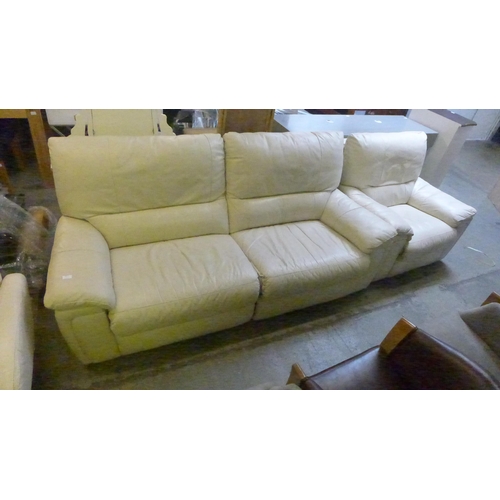 1517 - A cream leather reclining three seater sofa and armchair