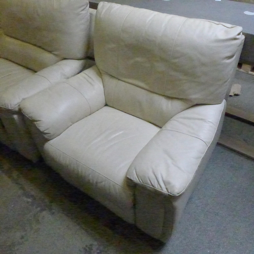 1517 - A cream leather reclining three seater sofa and armchair