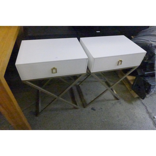 1530 - A pair of white bedside tables with cross legs