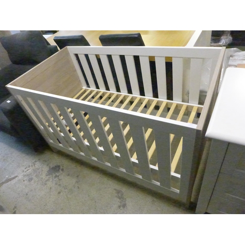 1537 - A white painted and wood look cot bed