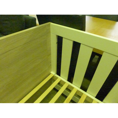 1537 - A white painted and wood look cot bed