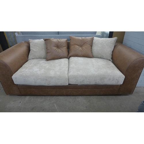 1459 - A brown and beige upholstered three seater sofa