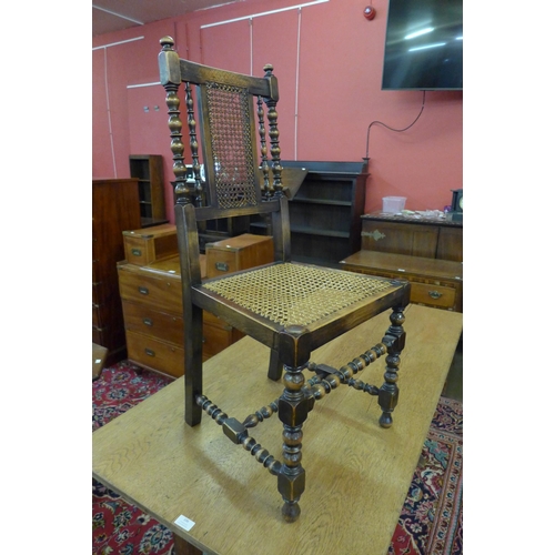 107 - A set of four early 20th Century beech bergere dining chairs