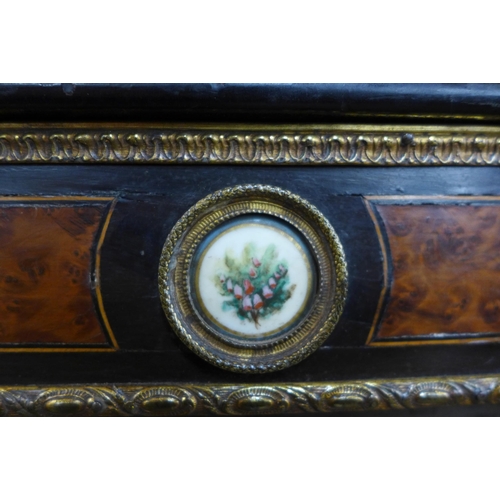 113 - A Victorian ebonised and amboyna side cabinet