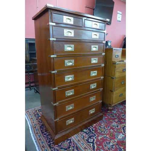 129 - A mahogany and brass mounted campaign style chest of drawers