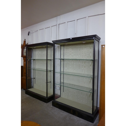 132 - A pair of Victorian ebonised open shop display cabinets, 198cms h, 129cms w, 39cms d