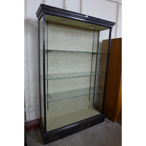 132 - A pair of Victorian ebonised open shop display cabinets, 198cms h, 129cms w, 39cms d