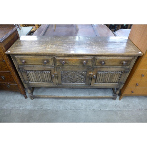 136 - An Elizabethan Revival carved Ipswich oak dresser