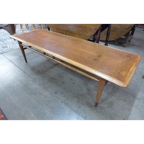 15 - An American oak and walnut coffee table, designed by Andre Bus for Lane, Altavista, Virginia