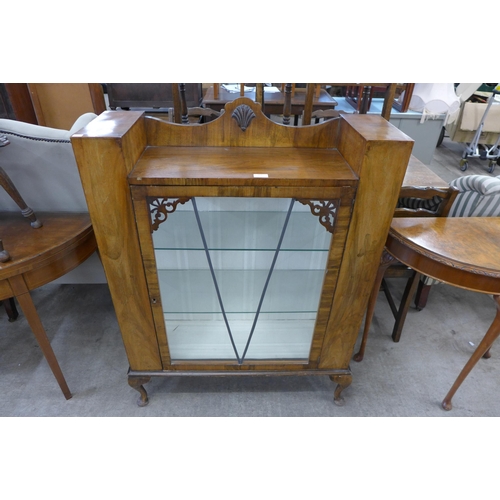 184 - An early 20th Century walnut display cabinet