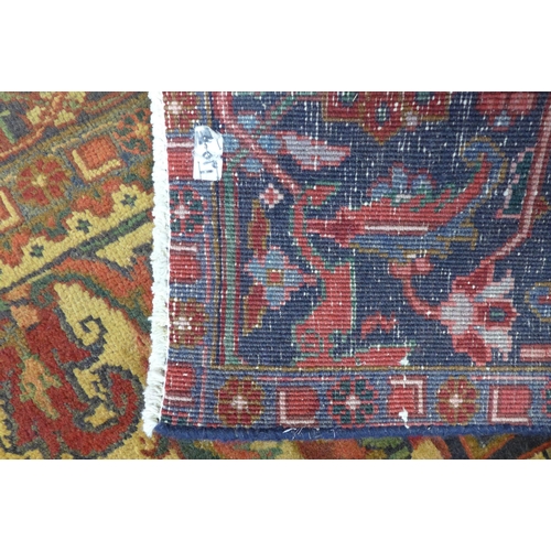 188 - An early 20th Century hand knotted Persian Herris rug, 322 x 240cms