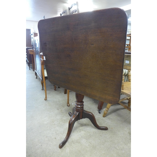 193 - A Victorian mahogany rectangular tilt top tripod tea table