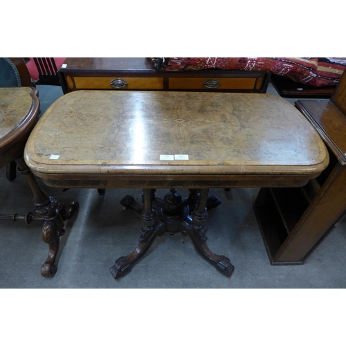 201 - A Victorian inlaid burr walnut fold over games table