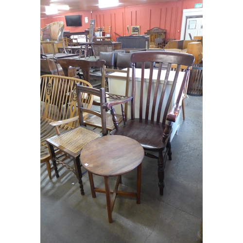 225 - An elm and beech farmhouse chair, two Edward VII bedroom chairs and a walnut occasional table