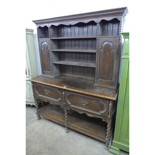 237 - An early 20th Century Jacobean Revival carved oak dresser