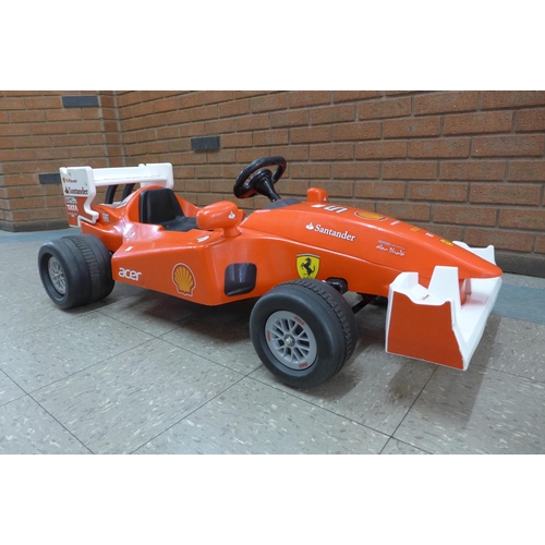 251 - A limited edition Ferrari F1 Indy ride on car, Formula 1 W/12 volt battery power - with charging lea... 