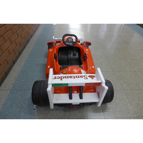 251 - A limited edition Ferrari F1 Indy ride on car, Formula 1 W/12 volt battery power - with charging lea... 