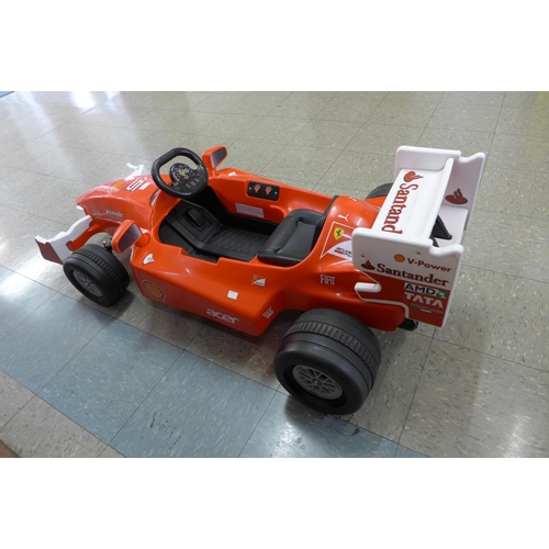 251 - A limited edition Ferrari F1 Indy ride on car, Formula 1 W/12 volt battery power - with charging lea... 