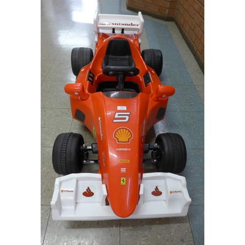 251 - A limited edition Ferrari F1 Indy ride on car, Formula 1 W/12 volt battery power - with charging lea... 