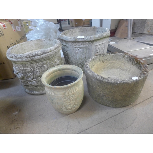 291 - Three concrete planters and a terracotta pot