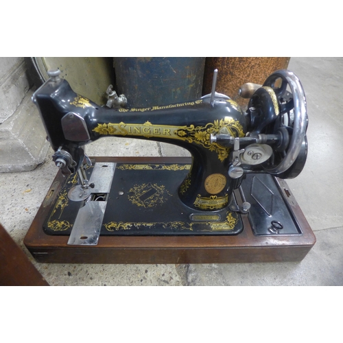 295 - A cased Singer sewing machine and a copper warming pan