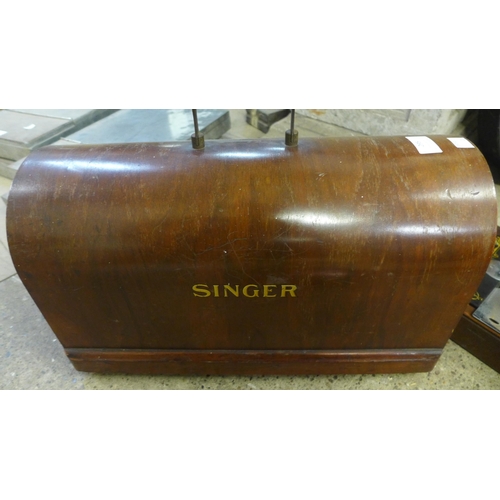 295 - A cased Singer sewing machine and a copper warming pan