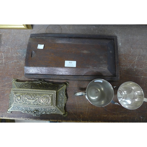 322 - A brass stamp holder, a pair of plated mugs and a small oak box