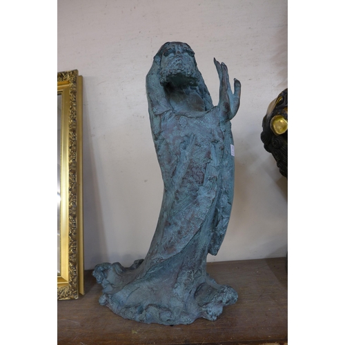 335 - A surrealist bronze figure of an immortal