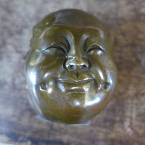 361 - A small oriental bronze four faced Buddha