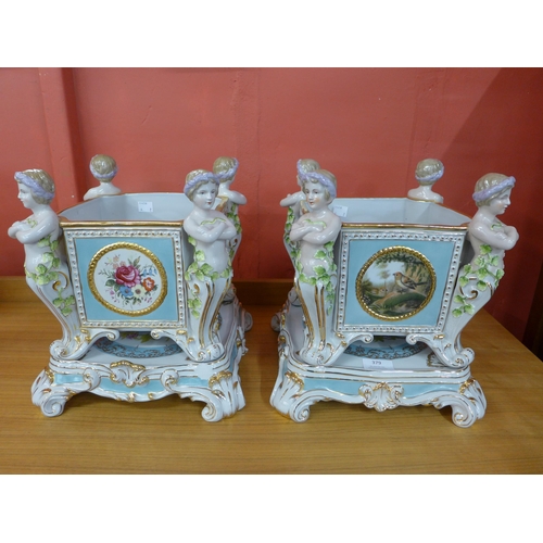 379 - A pair of French style porcelain cache pots on stands