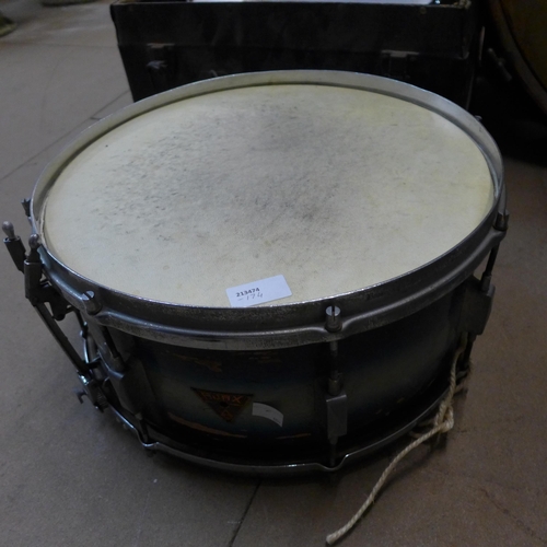 383 - A vintage bass drum, two snare drums and a small tom tom drum, drum sticks and brushes