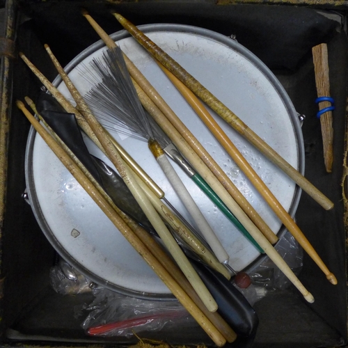 383 - A vintage bass drum, two snare drums and a small tom tom drum, drum sticks and brushes